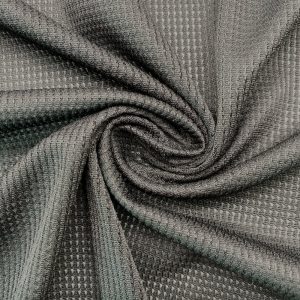 Black jacquard mesh knit, 88.3% polyester / 11.7% elastane, 135 g/m²
